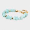 Handmade light blue jade bracelet by The Gem Stories featuring high-quality jade stones with gold accents.