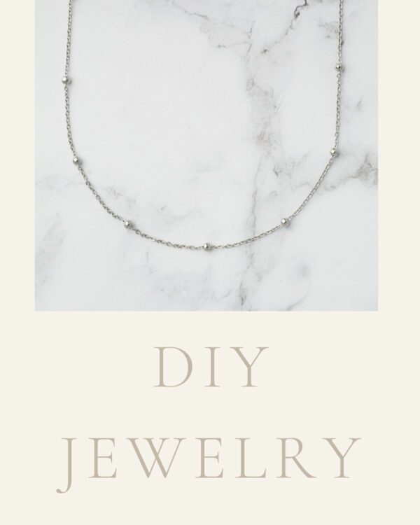 Long chain necklace with large rhodium-plated dots, showcasing a contemporary and elegant design.