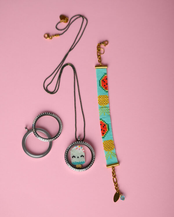 Miyuki Memory Locket and loom-stitched bracelet by The Gem Stories on a pink background.