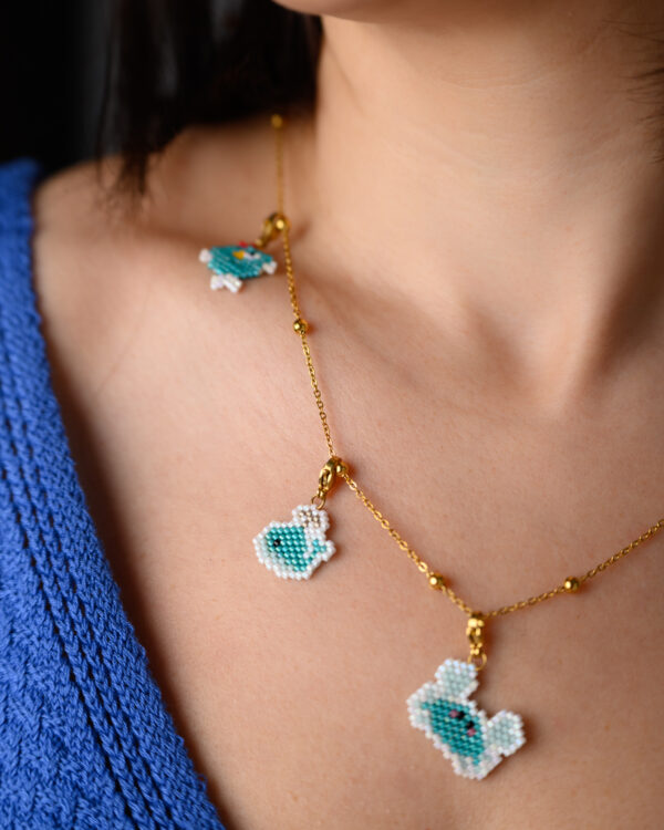 Miyuki hand-stitched sea animal charms on a necklace by The Gem Stories.