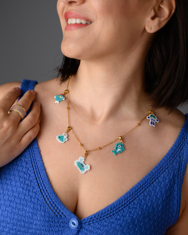 Miyuki sea animal charms necklace by The Gem Stories, highlighting the detailed beadwork on each charm.