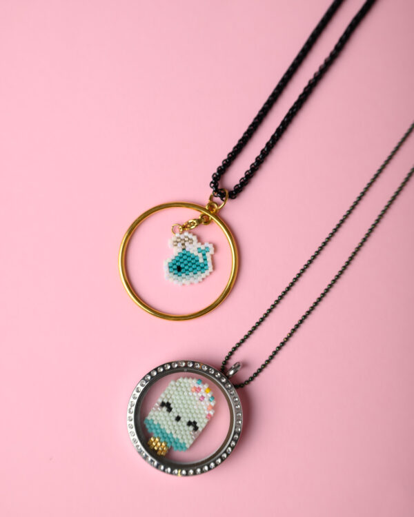 Miyuki hand-stitched summer elements on a Memory Locket and a 24k gold-plated circle base by The Gem Stories.