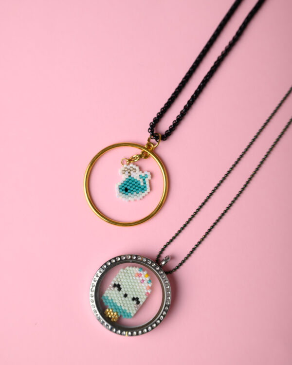 Miyuki hand-stitched summer elements on a Memory Locket and a 24k gold-plated circle base by The Gem Stories.