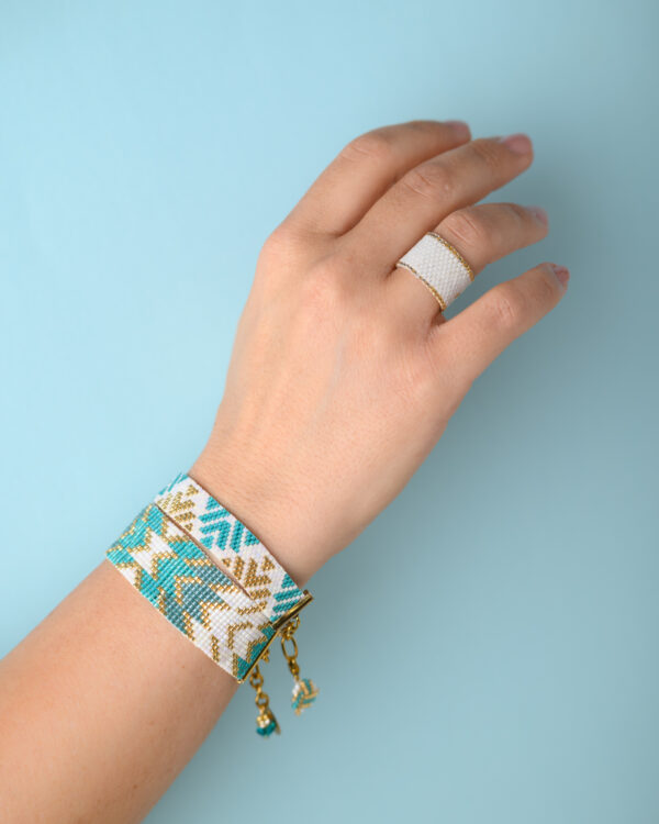Miyuki hand-stitched loom bracelet and ring by The Gem Stories, featuring intricate beadwork in turquoise and gold.
