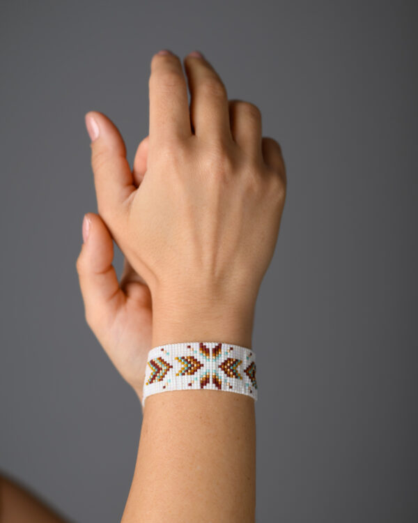 Model wearing Desert Star Bracelet by The Gem Stories, handcrafted with Miyuki beads and loom stitch technique.