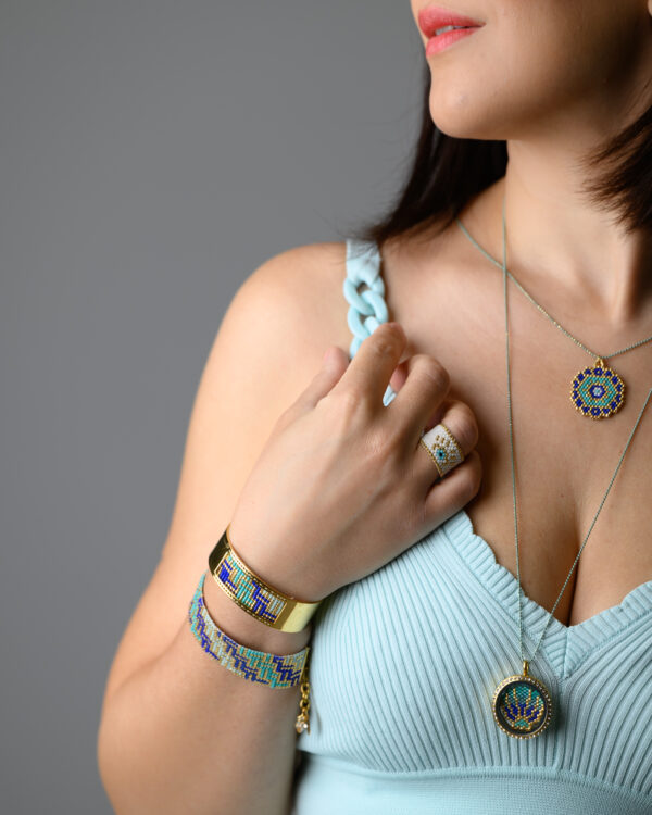 Miyuki jewelry collection by The Gem Stories, featuring a hand-stitched pendant necklace, bracelets, and rings with detailed beadwork.