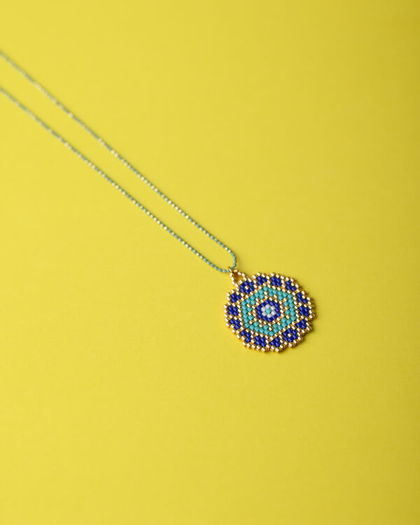 Azure Mandala Pendant by The Gem Stories, handcrafted with Miyuki beads in shades of blue and gold.