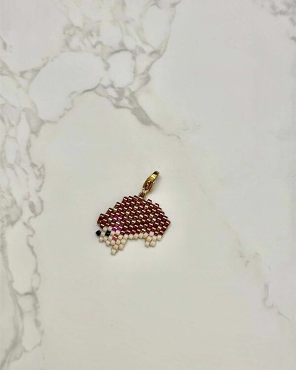 Miyuki beadwork hedgehog pendant in brown and white with a gold clasp.