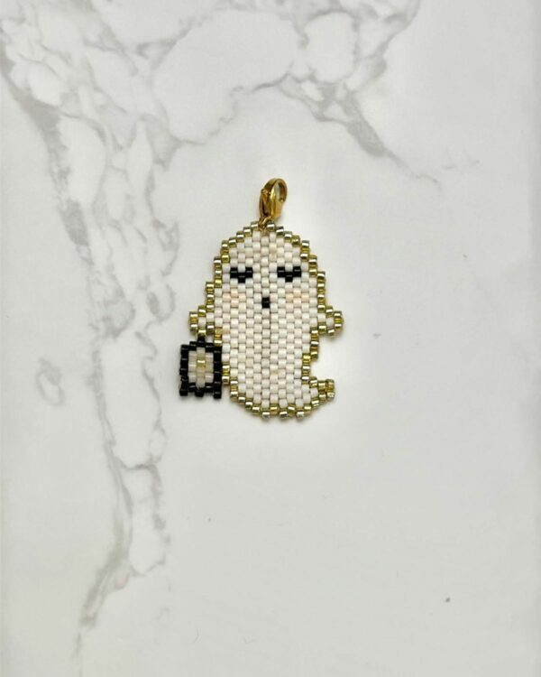 Miyuki beadwork large ghost pendant in white with gold accents, holding a black lantern.