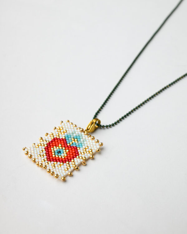 Close-up of Miyuki heart pendant with dot chain by The Gem Stories