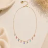 Handmade gold necklace with navette multicolor crystals by The Gem Stories