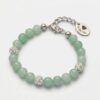 Mint green jade bead bracelet featuring shimmering Preciosa crystal pavé balls and rhodium-plated hardware, as seen in 9MRT5641-The-Gem-Stories-Mint-Jade-Bracelet-with-Preciosa-Crystal-Balls-Rhodium.jpg, showcased on a white background with a signature logo tag.