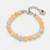 Honey-yellow citrine bead bracelet featuring three sparkling Preciosa crystal pavé balls and rhodium-plated silver-tone hardware, as shown in U1ES5640-The-Gem-Stories-Citrine-Bracelet-with-Preciosa-Crystal-Balls-Rhodium.jpg, displayed on a clean white background.
