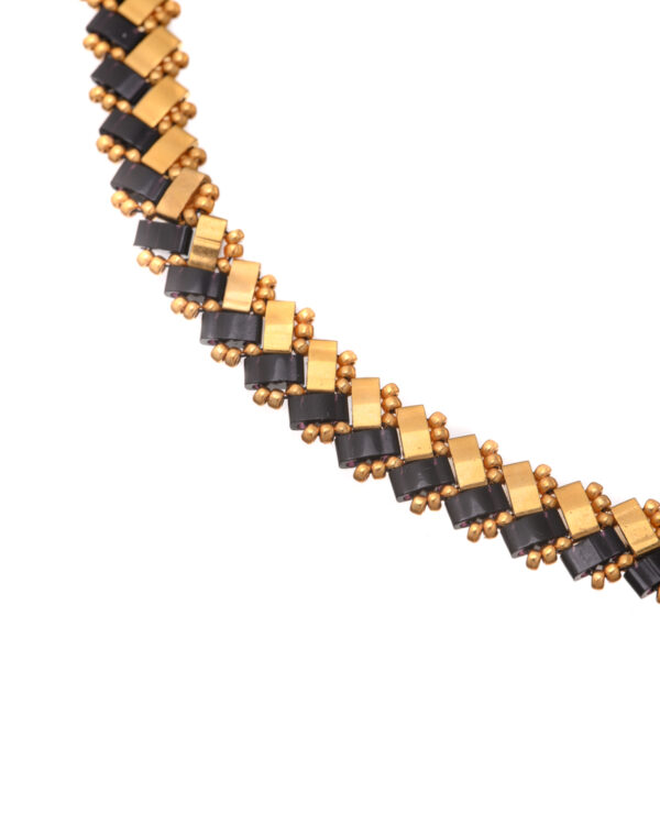 Intricate woven Miyuki Side Tila necklace with black and gold beads.