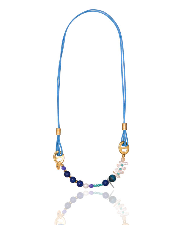 Multicolored gemstone necklace with blue cord, known as Azure Cascade Gemstone Necklace.
