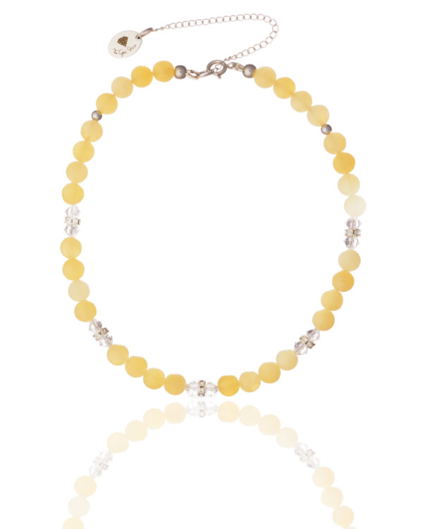Colorful necklace made from assorted calcite stones in varying hues.