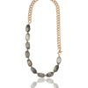 Long necklace with grey shaded beads and a gold chain