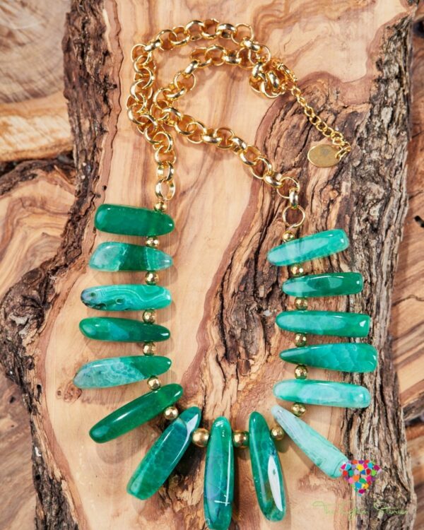 Green agate sticks necklace with gold chain displayed