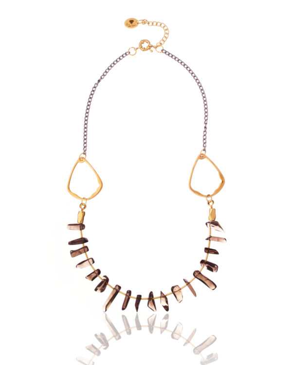 Elegant smoky quartz points necklace against a soft gray background.