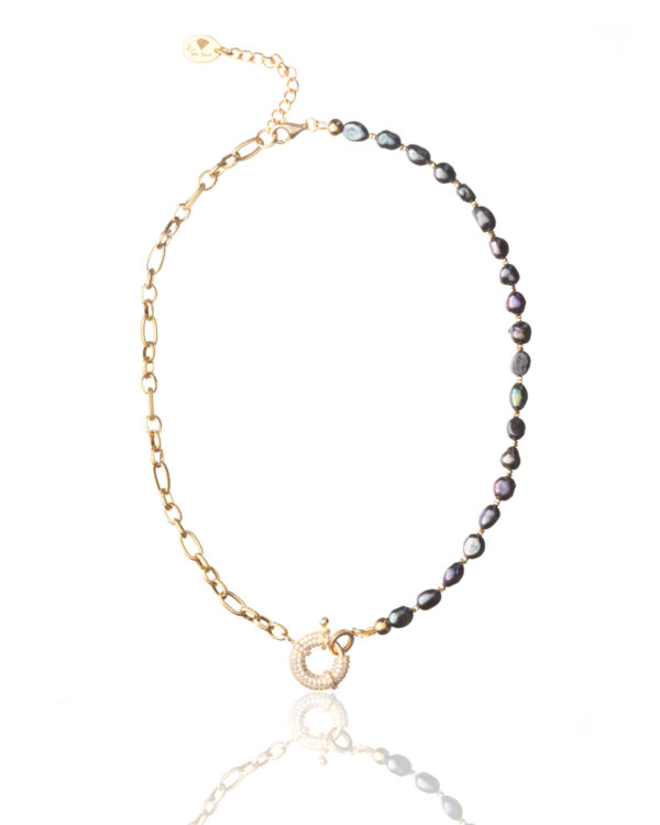 Gold necklace with alternating black pearls and chain links.