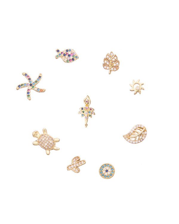 Assorted petit elements for memory lockets including a starfish, leaf, tree, turtle, and other decorative charms