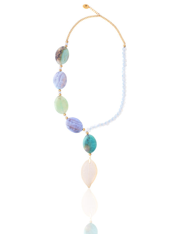 Leaf necklace with multicolored beads and a gold chain on a white background