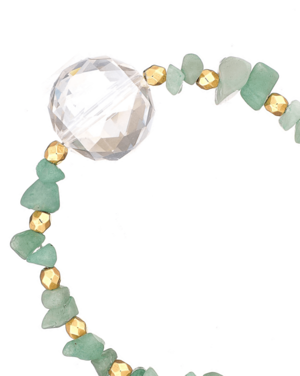 Close-up of aventurine bracelet with green aventurine chips, a large faceted clear bead, and gold accents on a white background