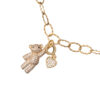 Gold necklace with a teddy bear and heart charm