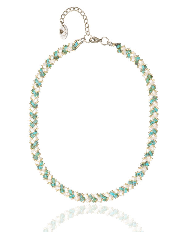Miyuki Side Tila necklace with turquoise Picasso and cream beads in a woven design.