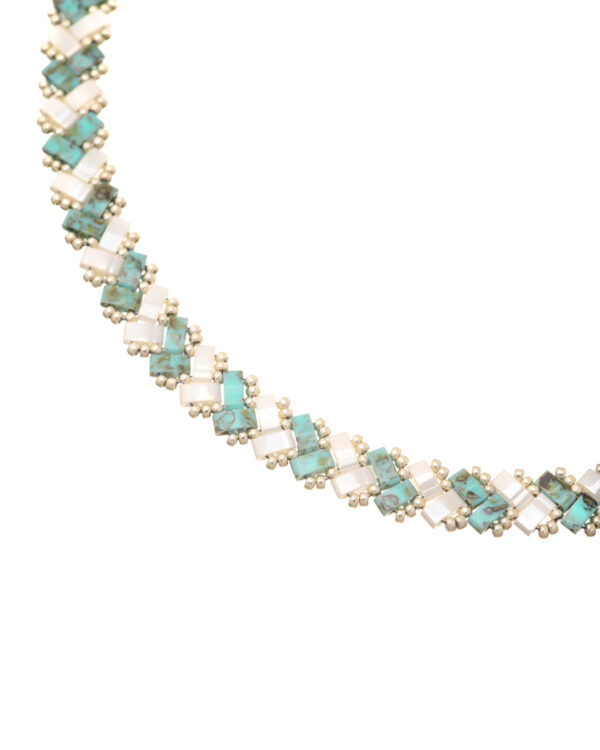 Turquoise Picasso and cream Miyuki Side Tila necklace with a woven bead pattern.
