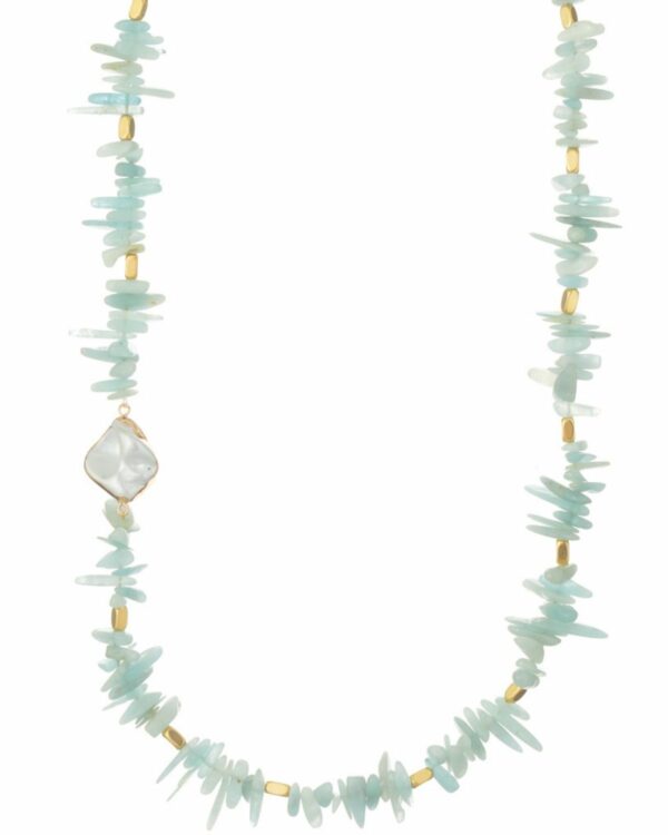 Delicate aquamarine chips necklace on a neutral backdrop.