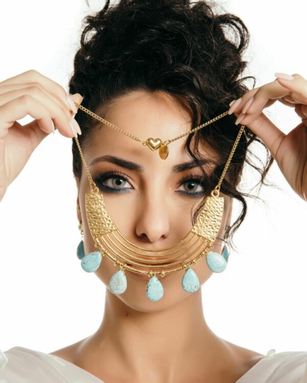 Gold necklace with light blue drops