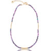 Single-strand necklace with purple agate beads and gold accents