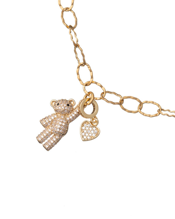 Gold necklace with a teddy bear and heart charm