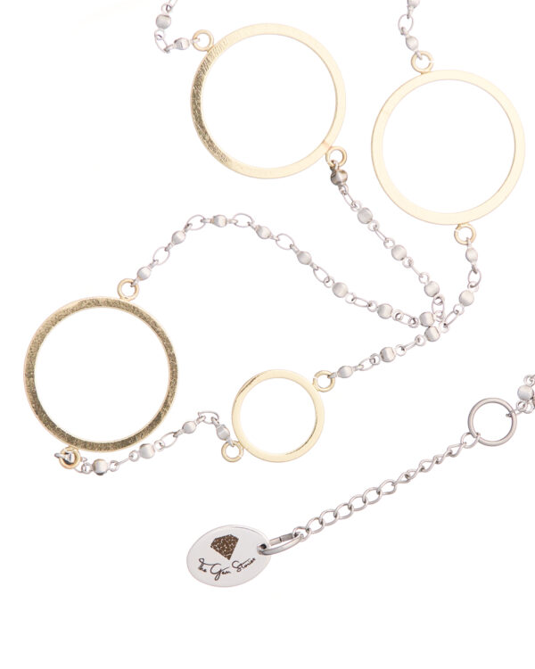 Necklace with gold round shapes and delicate chain, known as Long Necklace with Round Shapes.