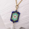 Miyuki Cuties Element – Blue Eye pendant made with blue, green, and white beads on a gold chain