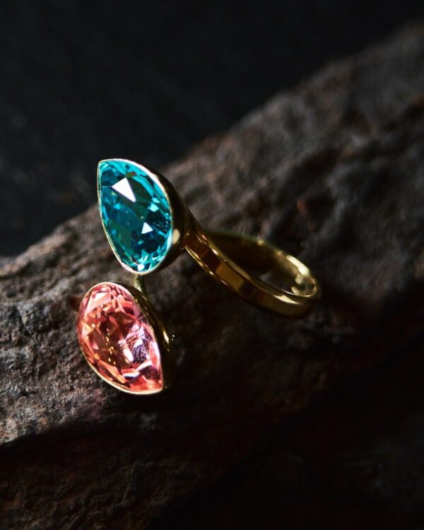Colorful crystal rings with intricate designs and vibrant hues