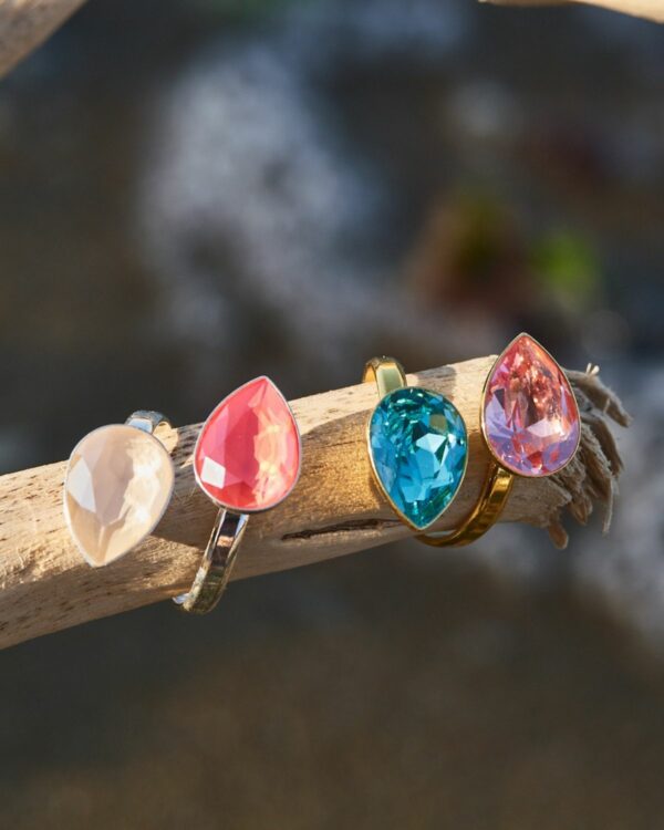 Assorted colorful crystal rings with intricate designs