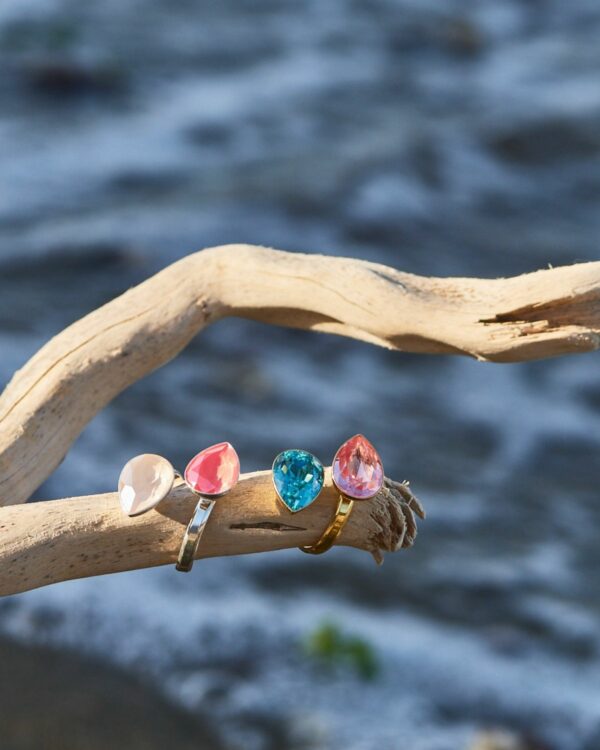 Colorful crystal rings in various vibrant hues