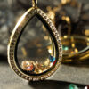 Elegant 24k gold plated teardrop floating memory locket with intricate charms