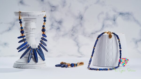 Lapis Lazuli Sticks Necklace, Matching Bracelet, and Jewelry on Marble Background