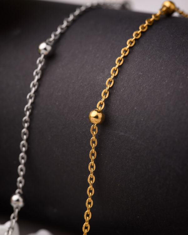 Elegant gold and silver long chain necklaces with delicate bead details