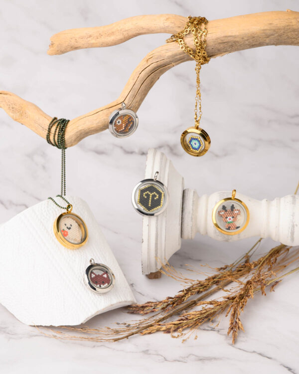 Memory lockets featuring Miyuki Cuties Elements with various designs including a fox, snowman, reindeer, zodiac sign, and evil eye.
