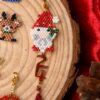 Festive Miyuki Cuties Elements XMAS pendants featuring Santa Claus, reindeer, and a red tassel.