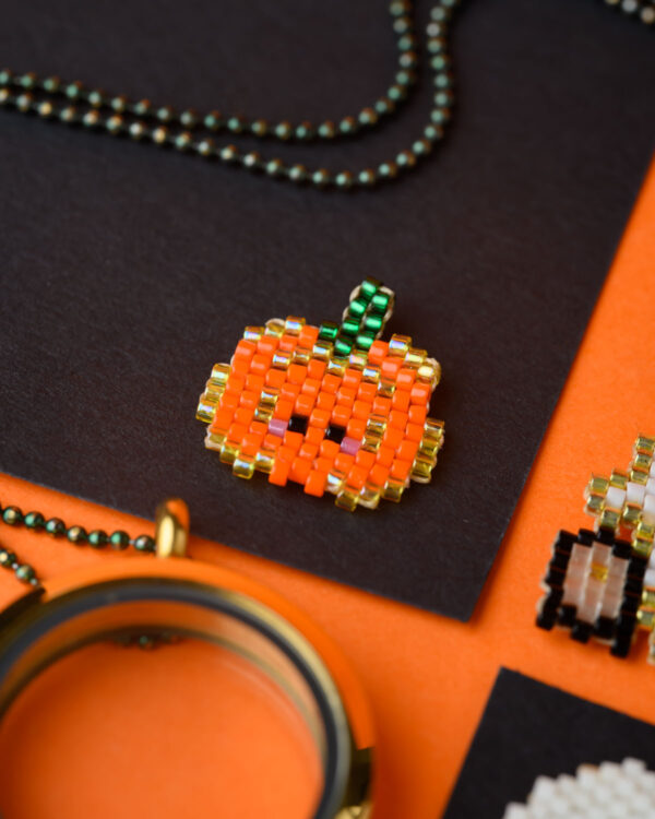 Miyuki Cuties Halloween Element Pumpkin pendant with orange, green, and yellow beads