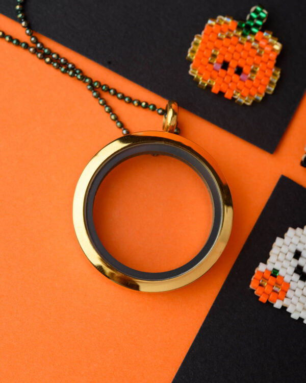 Miyuki Cuties Halloween Elements featuring beaded pumpkin and ghost designs alongside a gold-framed locket