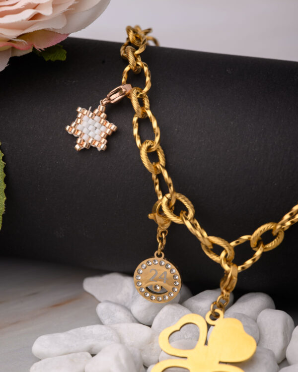Gold necklace chain for DIY projects with trefoil element and decorative charms