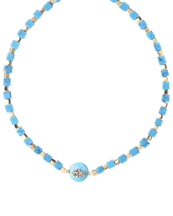 Turquoise cubes necklace with gold elements and a central fish pendant on a white background