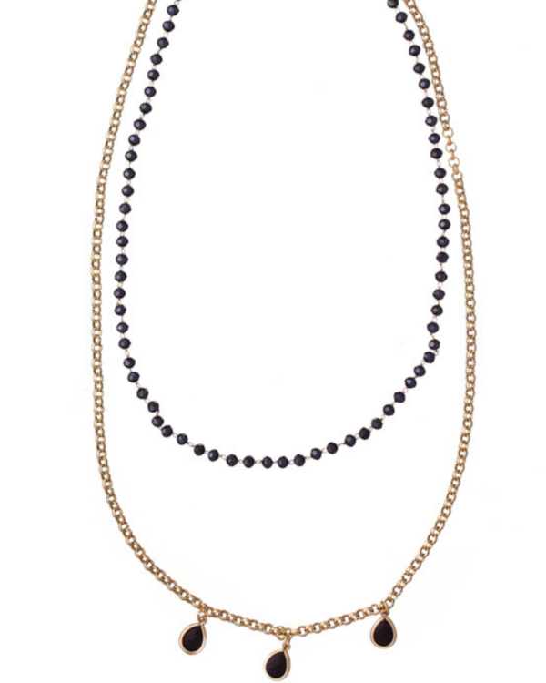 Rosario necklace with sparkling drop elements on an elegant display.