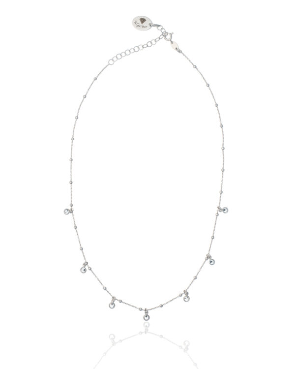 Rhodium plated necklace with delicate white drop pendants.